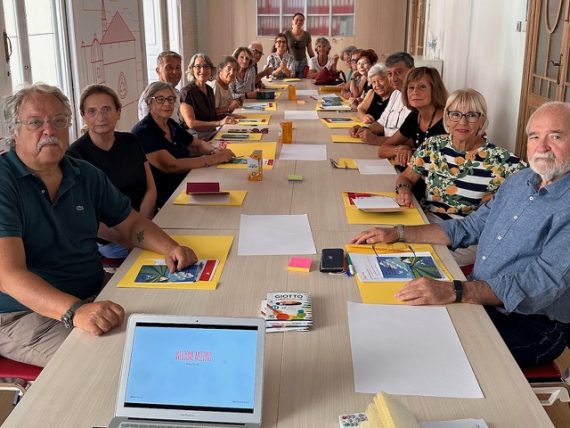 Group of smiling senior Erasmus+ participants from Sicily at their start of Erasmus+ project in Valencia, Spain.